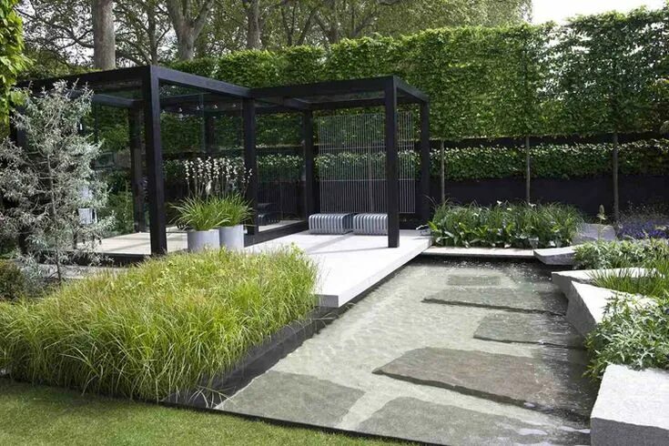 Garden group ландшафтный дизайн jardin moderne aménagé avec une pergola, des parterres de fleurs et de graminées