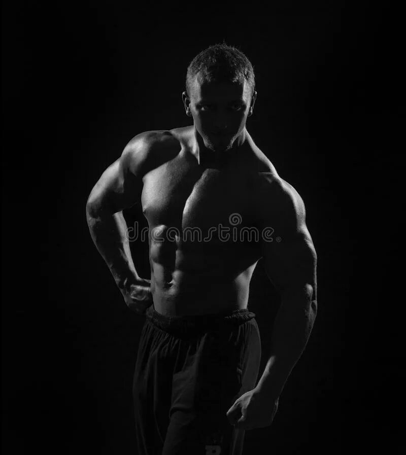 Качки черно белое фото Muscular Torso Man with Dumbbell on Black Background in Studio Stock Image - Ima