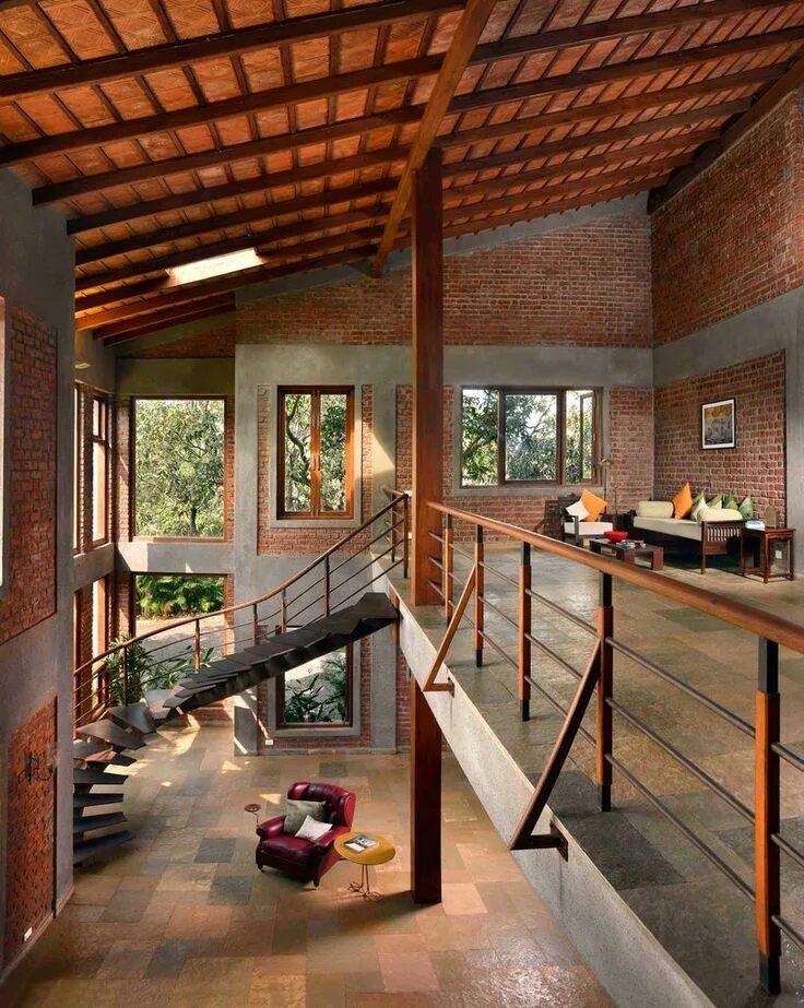 Каркасный дом в стиле лофт studio PKA's mango house uses earthy tones to reconnect with natural environment