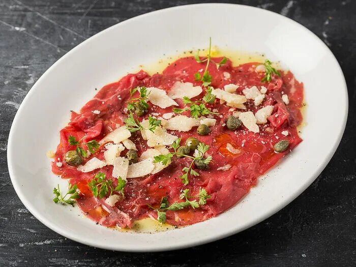 Карпаччо из говядины фото Заказать "Карпаччо из говядины" из Osteria Mario в Химках через Яндекс Еду