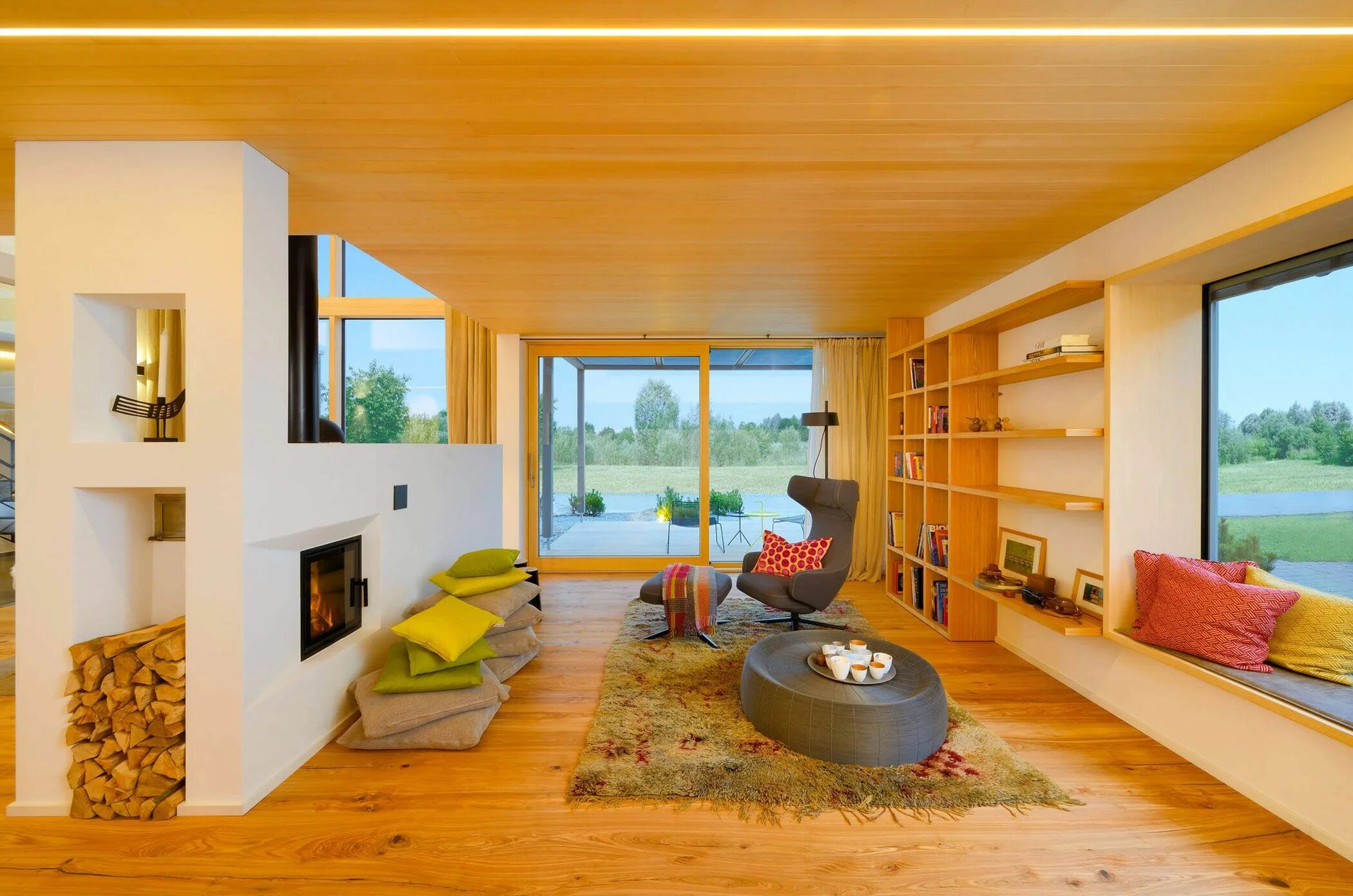 Картинки интерьера дома внутри Bright sitting area with a wood-burning fireplace in this home in Munich, German
