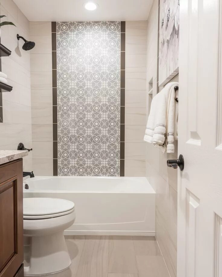 Картинки кафеля в ванной комнате фото The shower wall features a center panel with accent tiles from Cement Tile Shop 