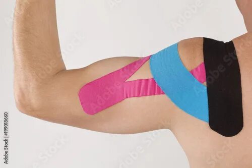 Кинезио ростов на дону фото медицинский Physiotherapy tape on mans shoulder. фотография Stock Adobe Stock