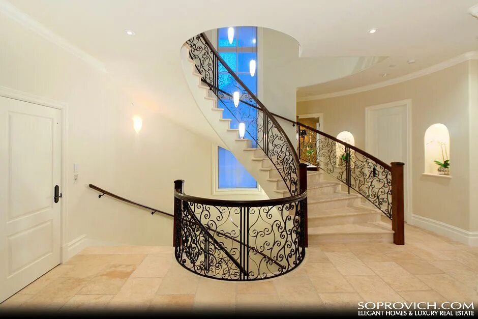 Красивые перила для лестниц фото Curved Staircase with Solid Marble Treads & Custom Wrought Iron Railing Railing 