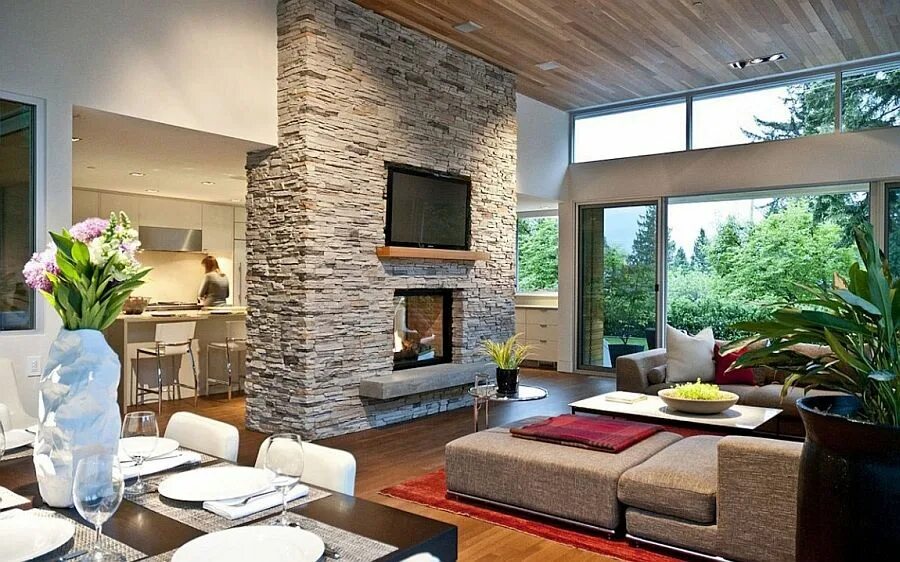 Красивый и недорогой дизайн дома Open floor living area of the Forest House with a smart fireplace at its heart