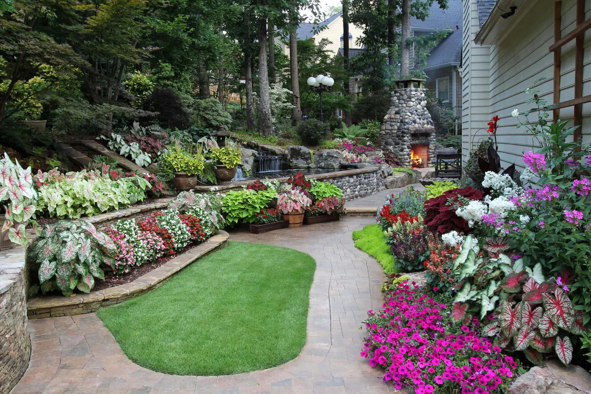Красивый ландшафтный дизайн Download Enchanting Cottage Garden in Full Bloom Wallpaper Wallpapers.com