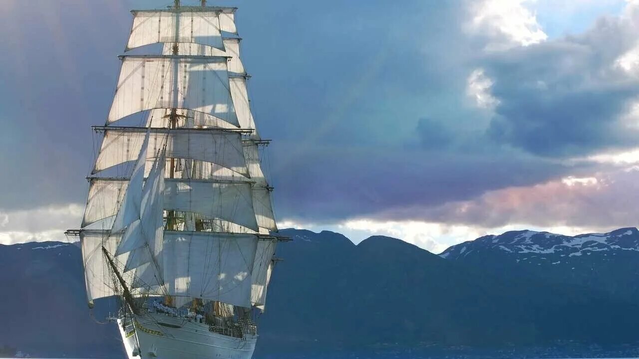 Красивый парусник в море фото Картина на холсте 60x110 Альянс Лес "Море небо лучи парусник горы" на подрамнике