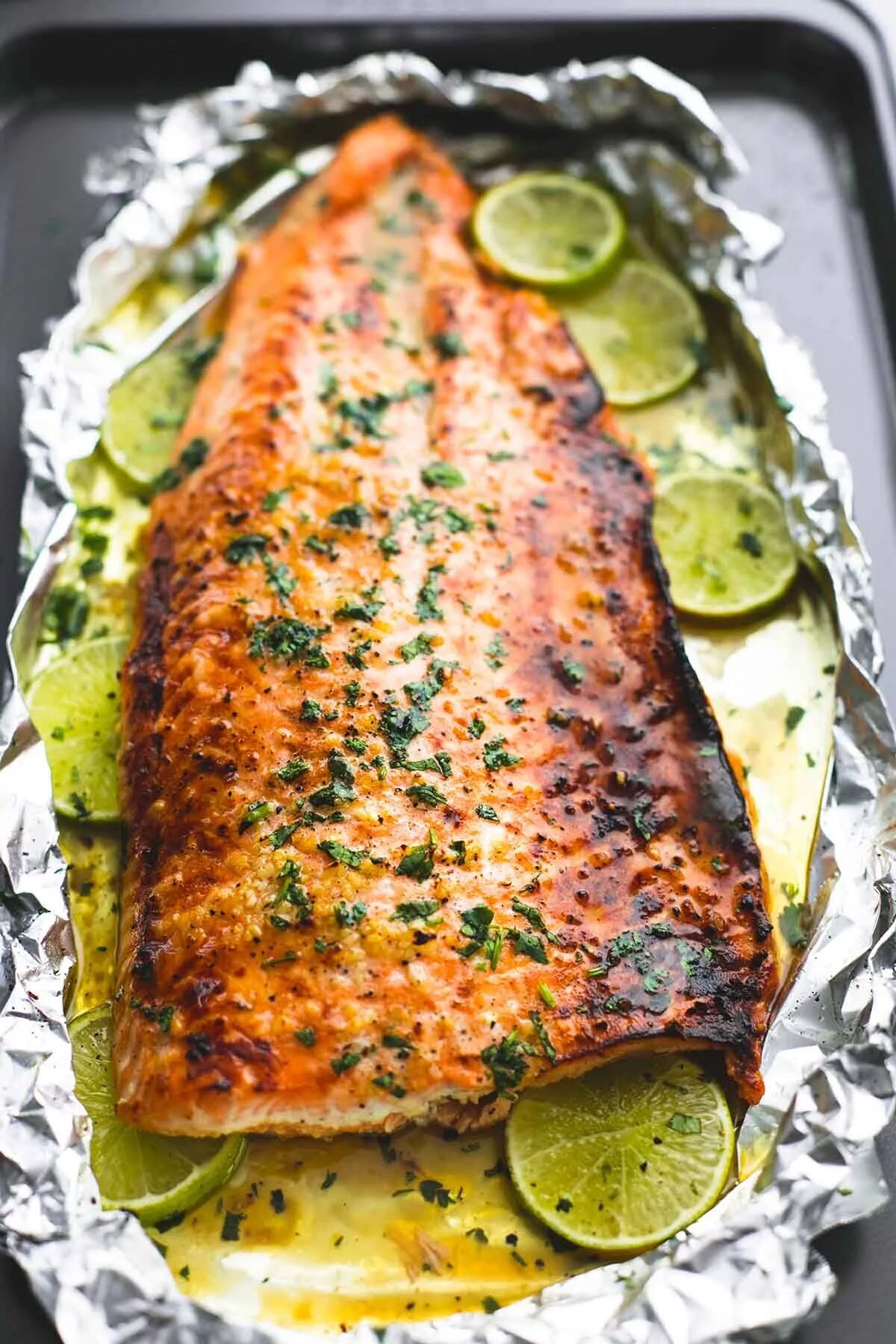Лосось запеченный в духовке фото Baked honey cilantro lime salmon in foil is cooked to tender, flaky perfection i