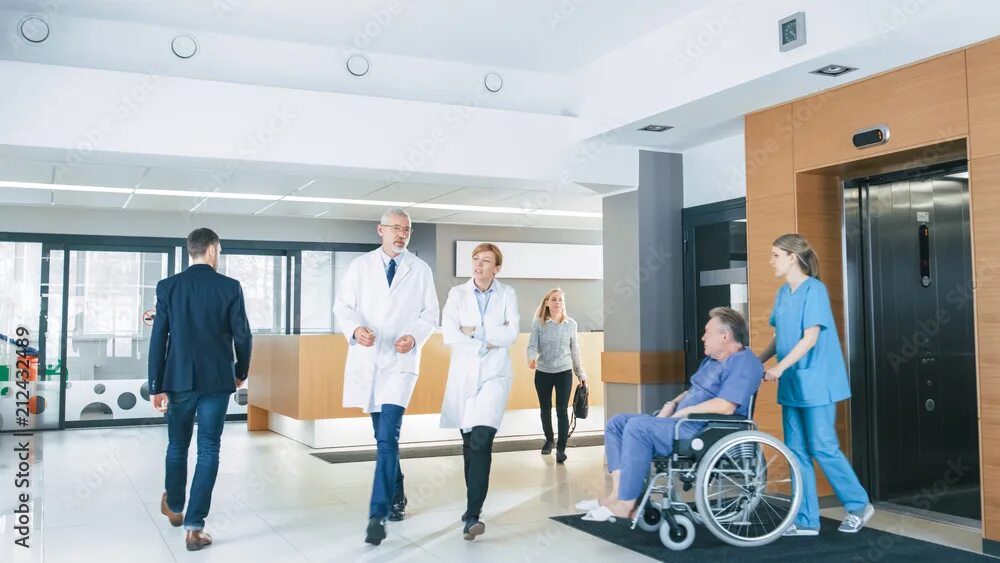 Мед учреждения фото First Floor of the Busy Hospital, Doctors, Nurses and Personnel Busy Working, As