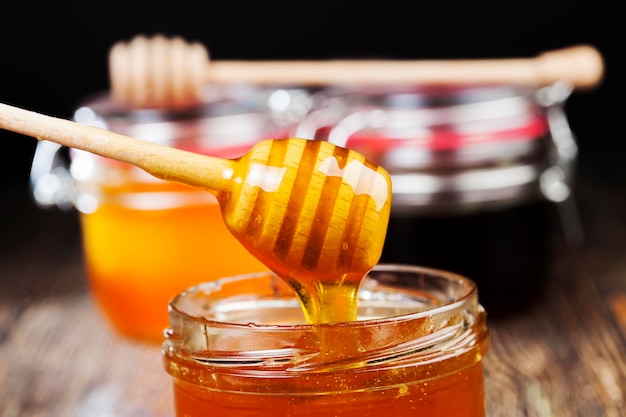 Мед янтарный фото Premium Photo Beautiful natural honey of amber color, bee honey