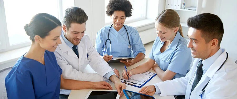 Медицинская организация фото group of happy doctors meeting at hospital office - The Michener Institute