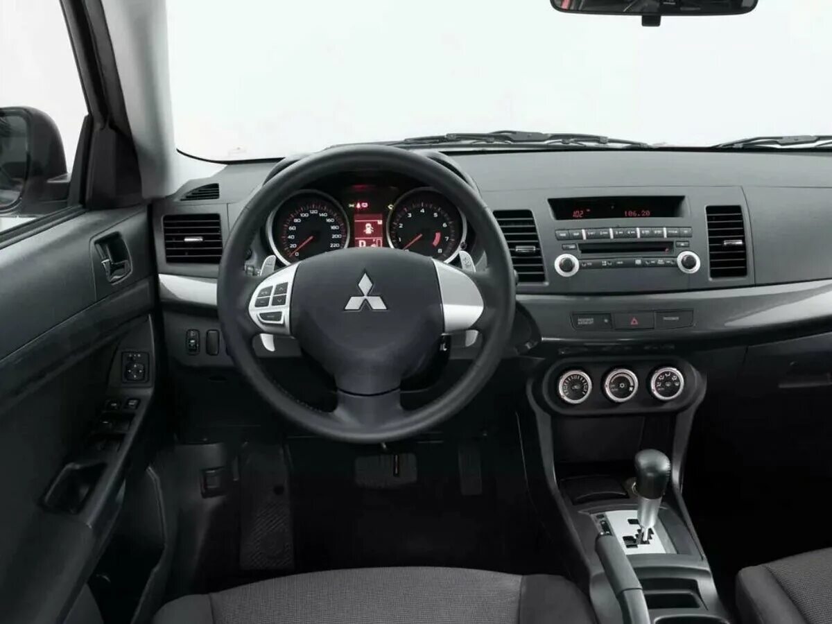 Митсубиси лансер фото салона Купить б/у Mitsubishi Lancer X 1.5 AT (109 л.с.) бензин автомат в Москве: чёрный