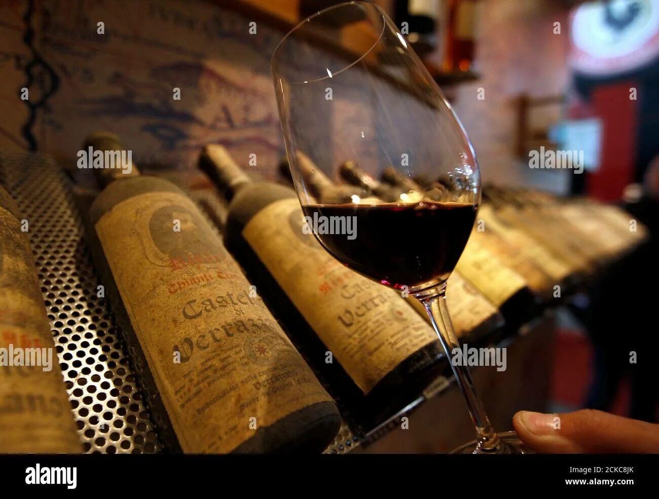 Найти вино по фото онлайн бесплатно A glass of Chianti red wine is displayed during the Vinitaly wine expo in Verona