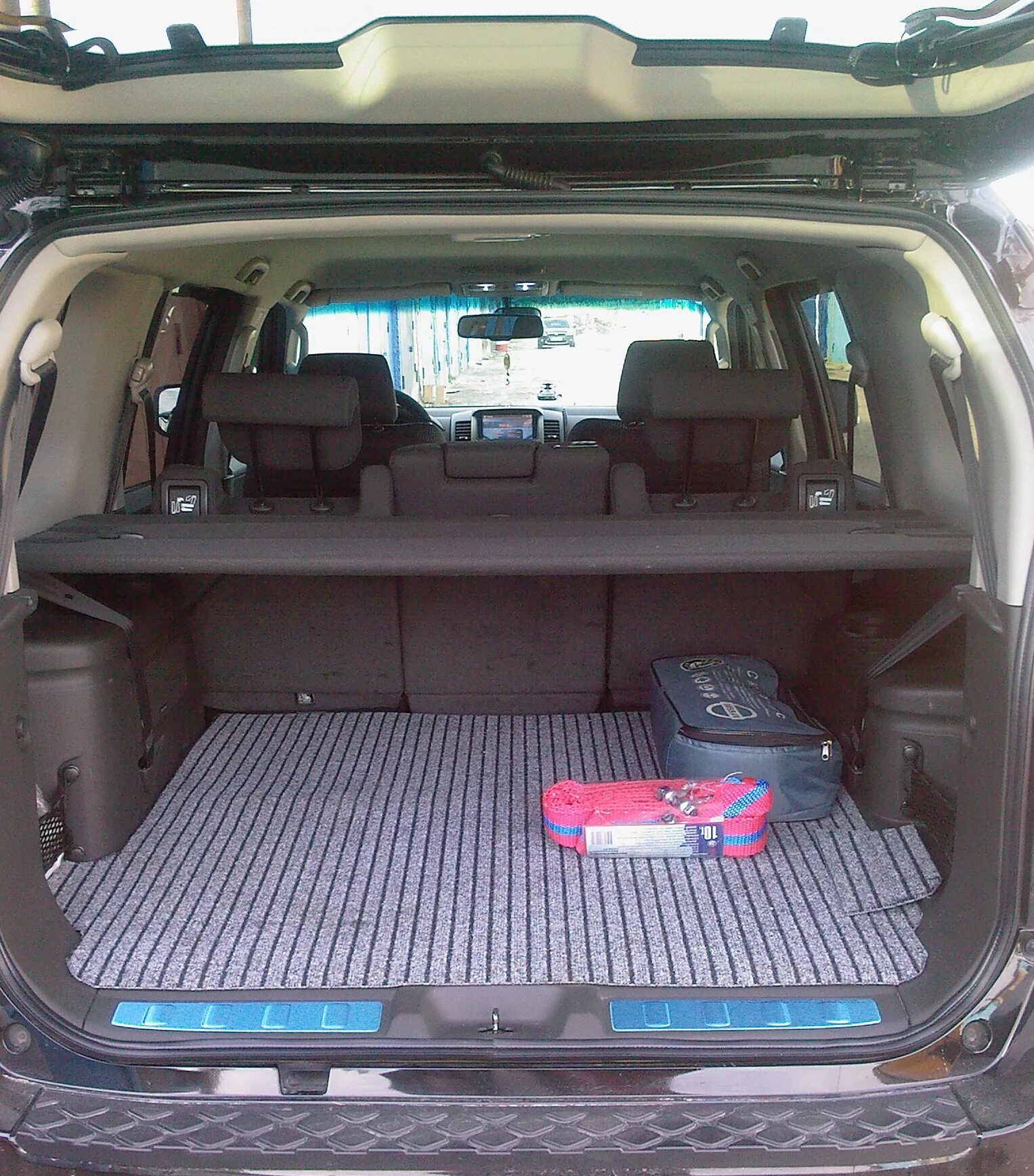 Ниссан патфайндер фото салона и багажника Ковер в багажник - Nissan Pathfinder (3G), 2,5 л, 2008 года аксессуары DRIVE2