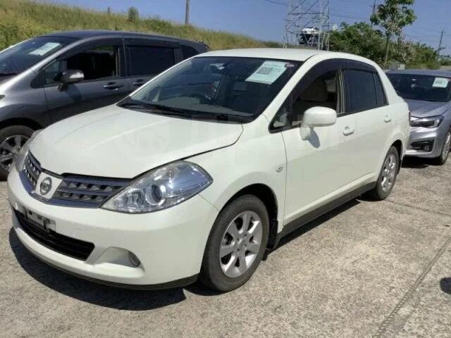 Ниссан тиида латио фото Купить Трос капота Nissan Tiida Latio 2009 65621ED000 SC11-150851 HR15 в Благове