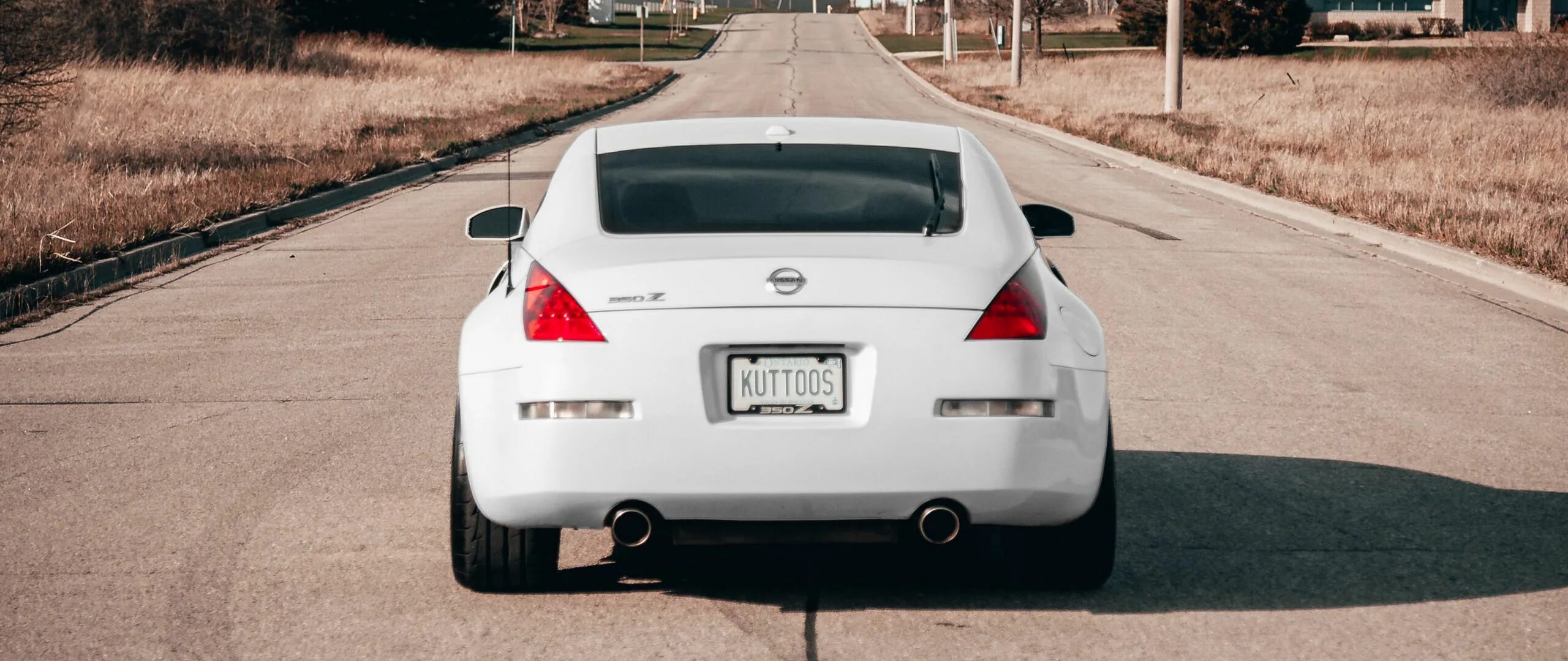 Ниссан вид сзади фото Download wallpaper 2560x1080 nissan 350z, nissan, sports car, rear view, white d