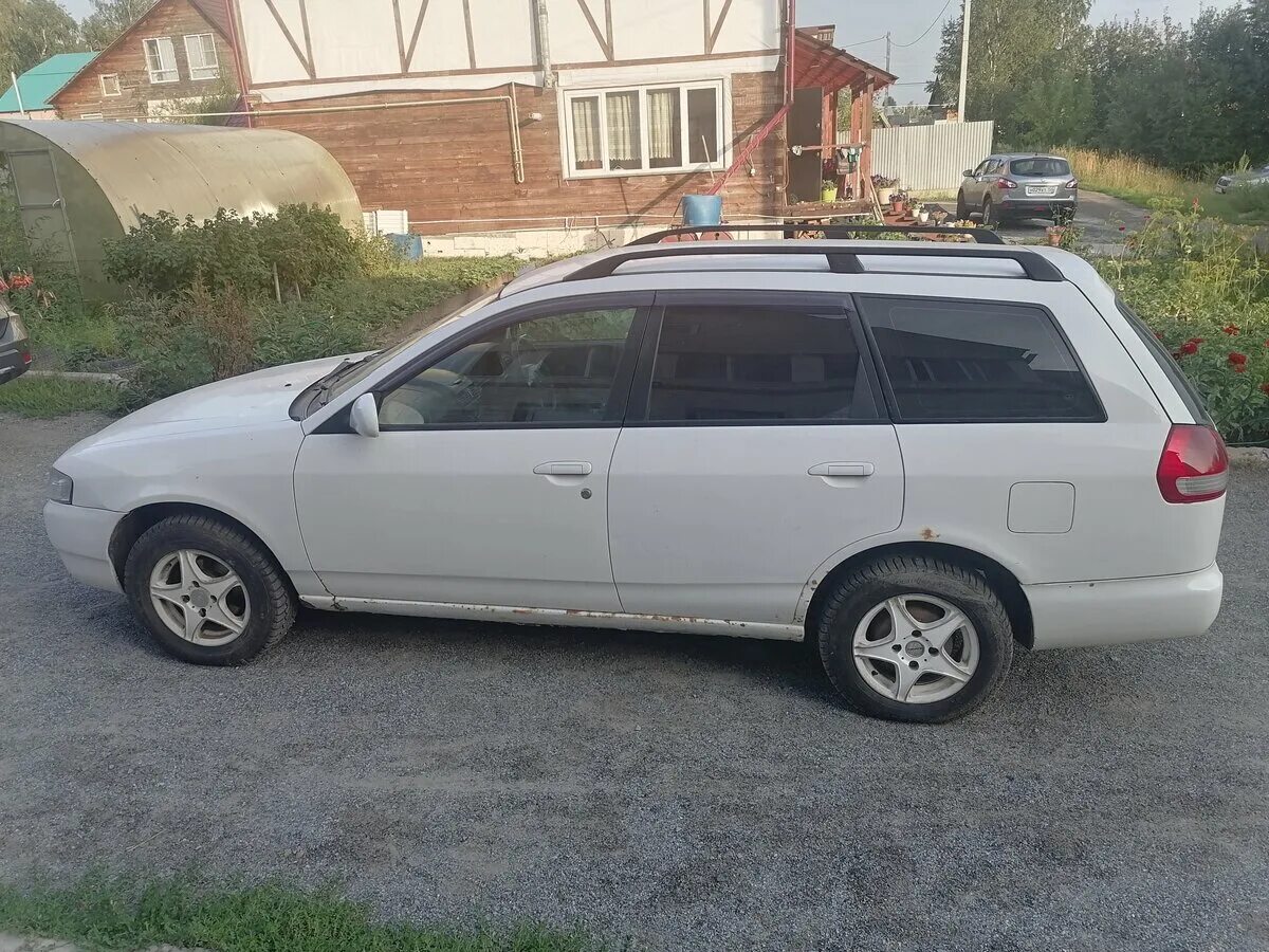 Ниссан вингроад y11 фото Купить б/у Nissan Wingroad II (Y11) 1.8 AT (120 л.с.) 4WD бензин автомат в Новос