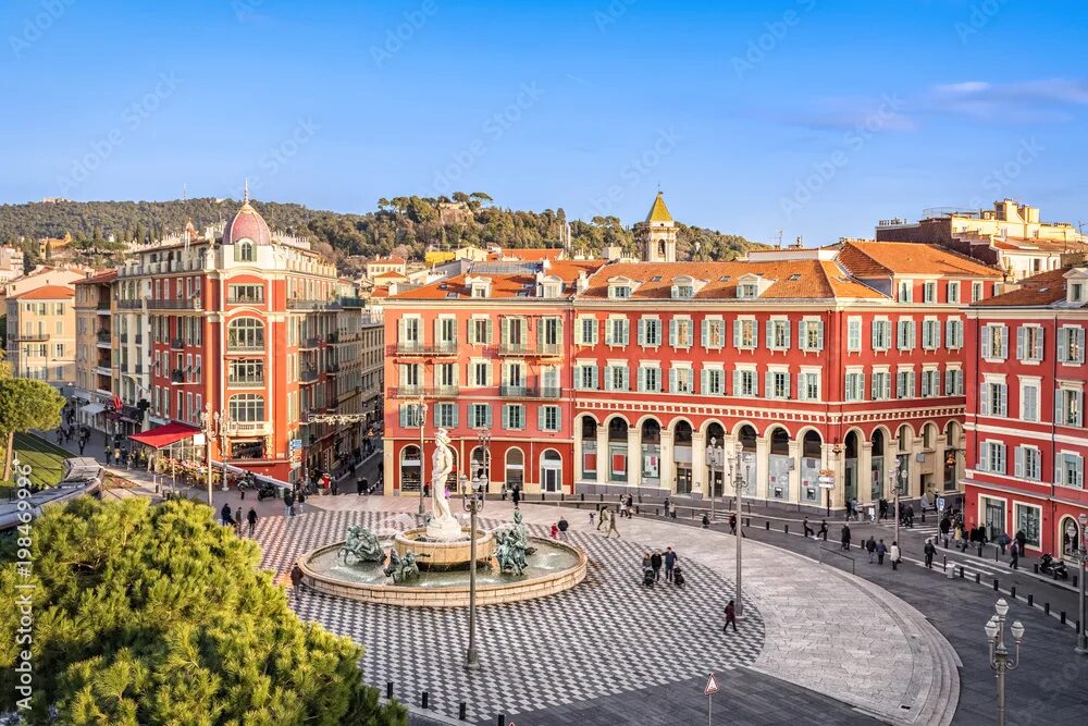 Ницца достопримечательности фото Aerial view of Place Massena square with red buildings and fountain in Nice, Fra