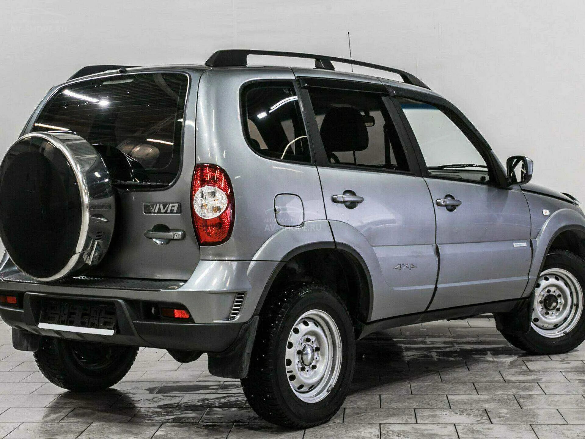 Нива шевроле цена новой фото Купить Chevrolet Niva 1.7 MT (80 л.с.) 4x4 2013 года, с пробегом в кредит Шеврол