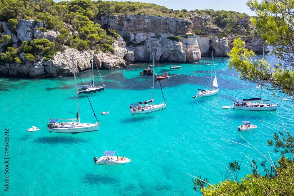 Острова испании фото Boats and yachts on Macarella beach, Menorca, Spain Stock Photo Adobe Stock