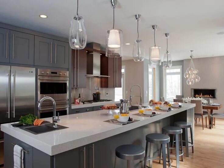 Освещение на кухне фото в интерьере Expansive Kitchen Island With Five Midcentury Pendant Lights Kitchen remodel sma