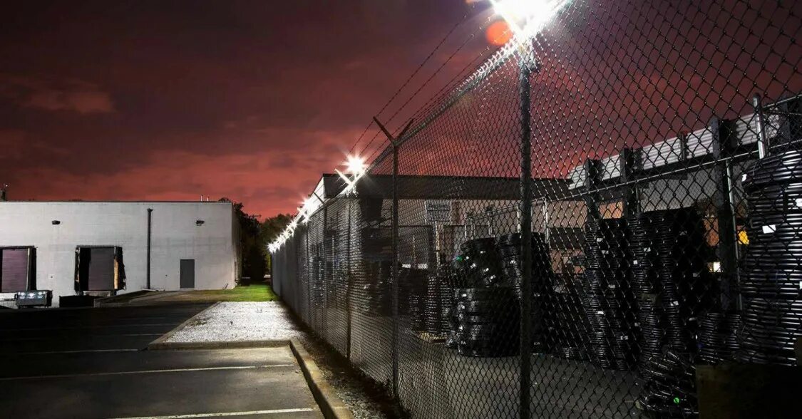 Освещение вдоль забора охранное на предприятии фото Enhance your property perimeter security with CAST