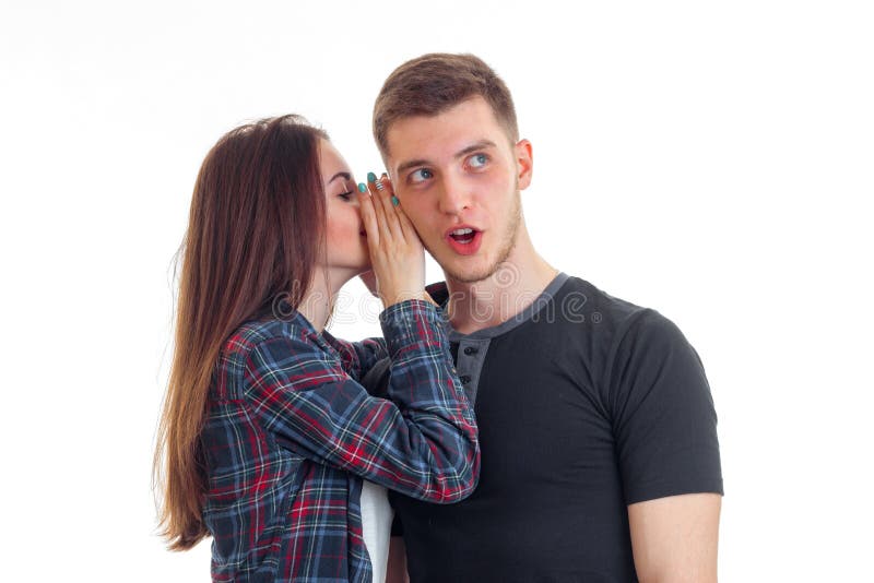 Оттягивать за уши парня девушку фото A Young Girl with Long Hair Said Something in Guy Ear Covering the Hands and he 