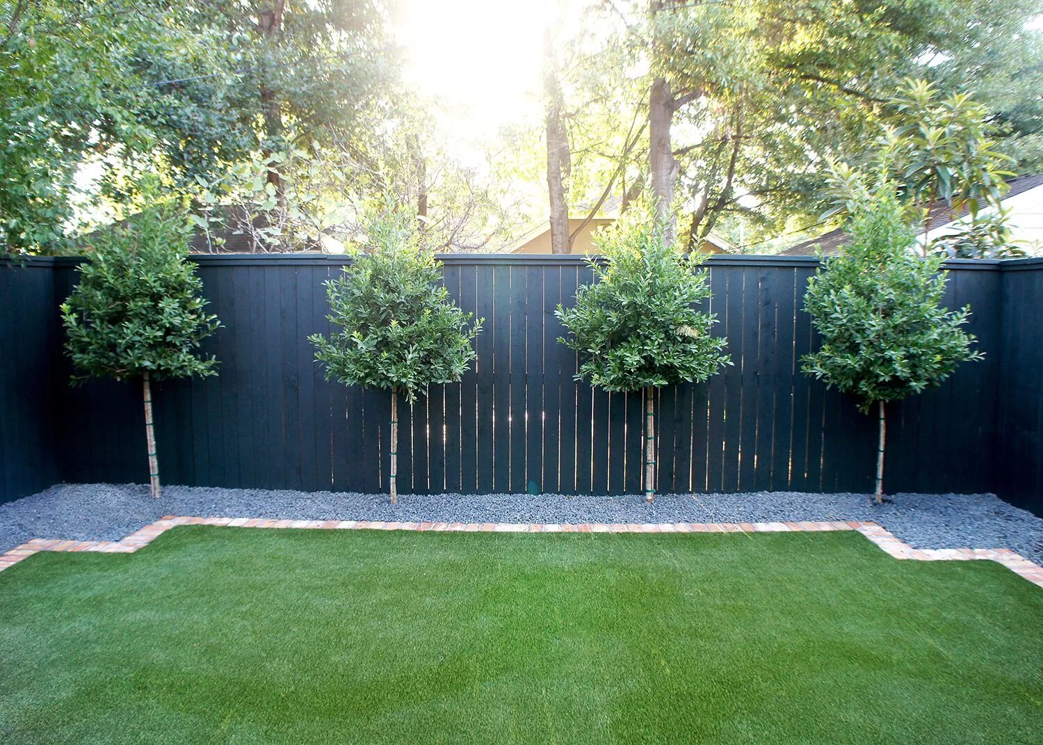 Озон фото забор для дачи A row of evenly spaced Eagleston Hollies line the back fence and will grow to ad