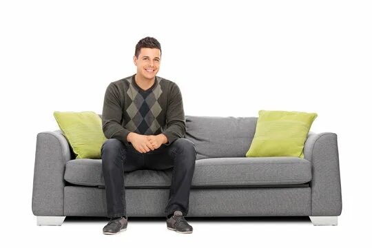 Парень сидит на диване фото Man Sitting On Couch Изображения: просматривайте стоковые фотографии, векторные 