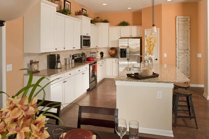 Персиковая кухня в интерьере Kitchen in the Twin Oaks model. Love the white cabinets and peach colored walls.