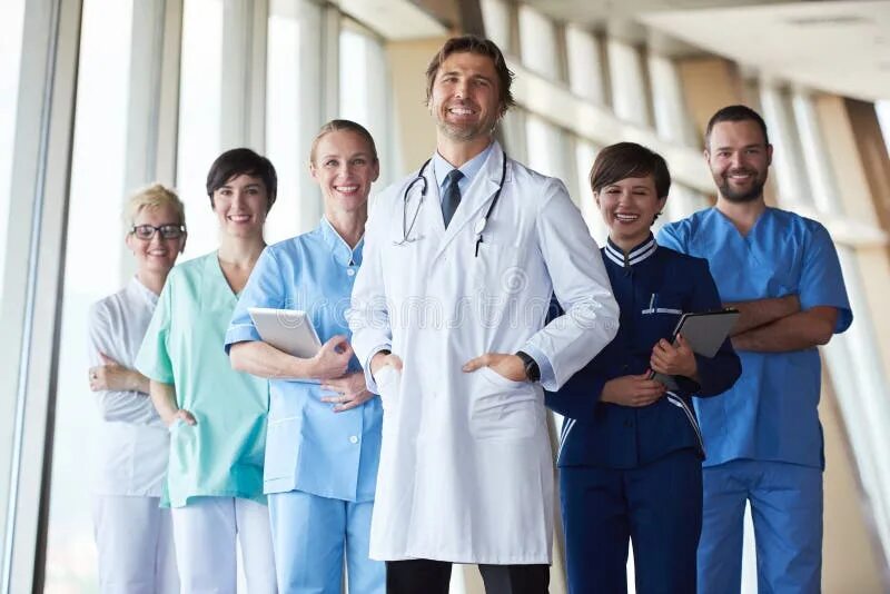 Персонал больницы фото Group of Medical Staff at Hospital, Handsome Doctor in Front of Stock Image - Im