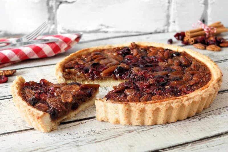 Пирог с конфетами фото Pecan Cranberry Pie with Slice Removed on White Wood Stock Photo - Image of home