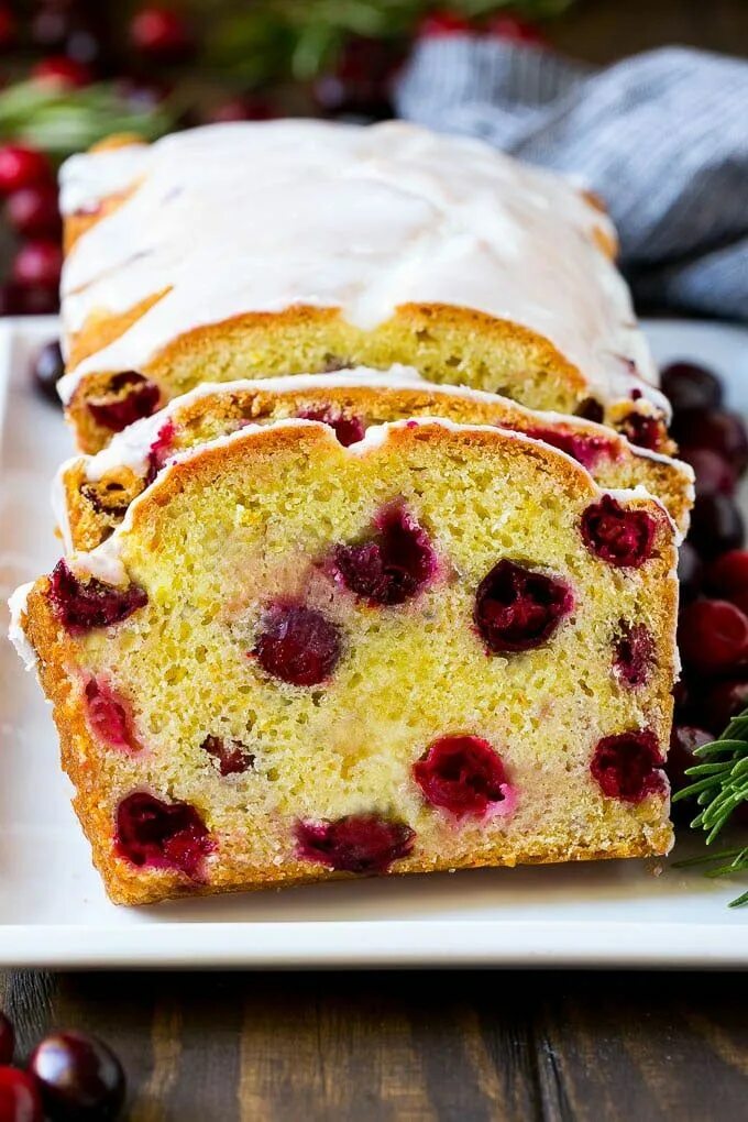 Пироги с клюквой рецепты с фото Sliced cranberry bread on a serving plate. Cranberry recipes, Cranberry bread, C
