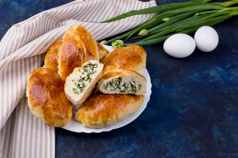 Пирожок лук с яйцом фото Delicious Little Pies with Green Onion and Egg. Traditional Russian Cuisine. Hom