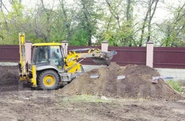 Планировка участка трактором jcb Благоустройство территории. Дренажные работы. Ремонт отмостки в Хабаровске