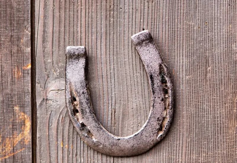 Подкова на двери фото Old Horseshoe for Luck on Wooden Door Stock Photo - Image of door, fortune: 5034