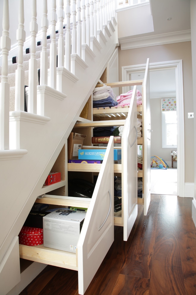 Подлестничное пространство в частном доме фото Traditional under stairs storage unit in London, UK - Классический - Лестница - 