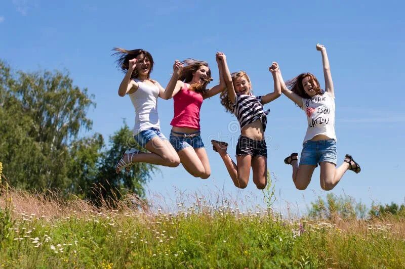 Подростки летнее фото Two Happy Teen Girls Lying on Green Grass and Holding Hands Stock Image - Image 