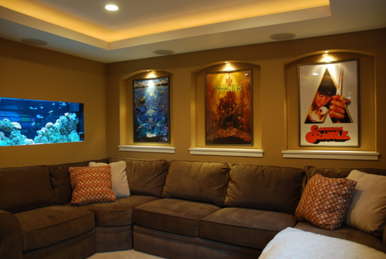 Подсветка картины на стене в интерьере Small home theater. A dramatic addition to this home theater is the 120 gallon s