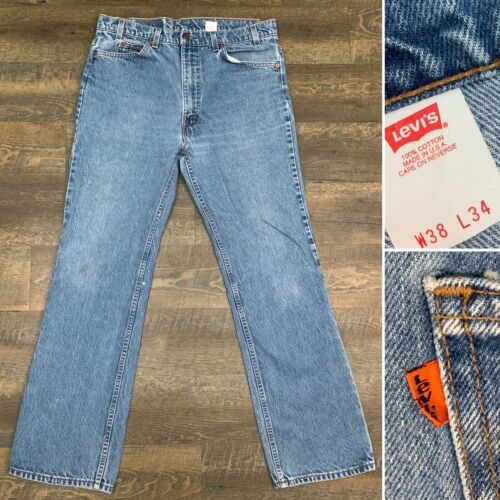 Покажи фото джинс Levis 517-винтажные 70s-80s расклешенные легкая потертость оранжевая вкладка син