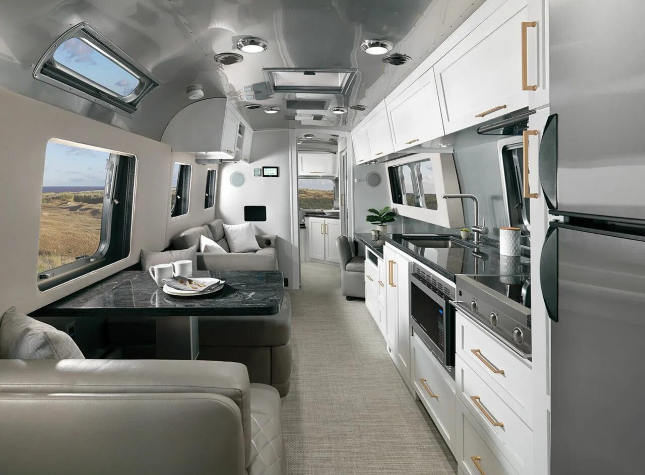 Покажи как выглядит дом на колесах Airstream's New "Comfort White" Travels In Style Airstream trailers, Apartment c