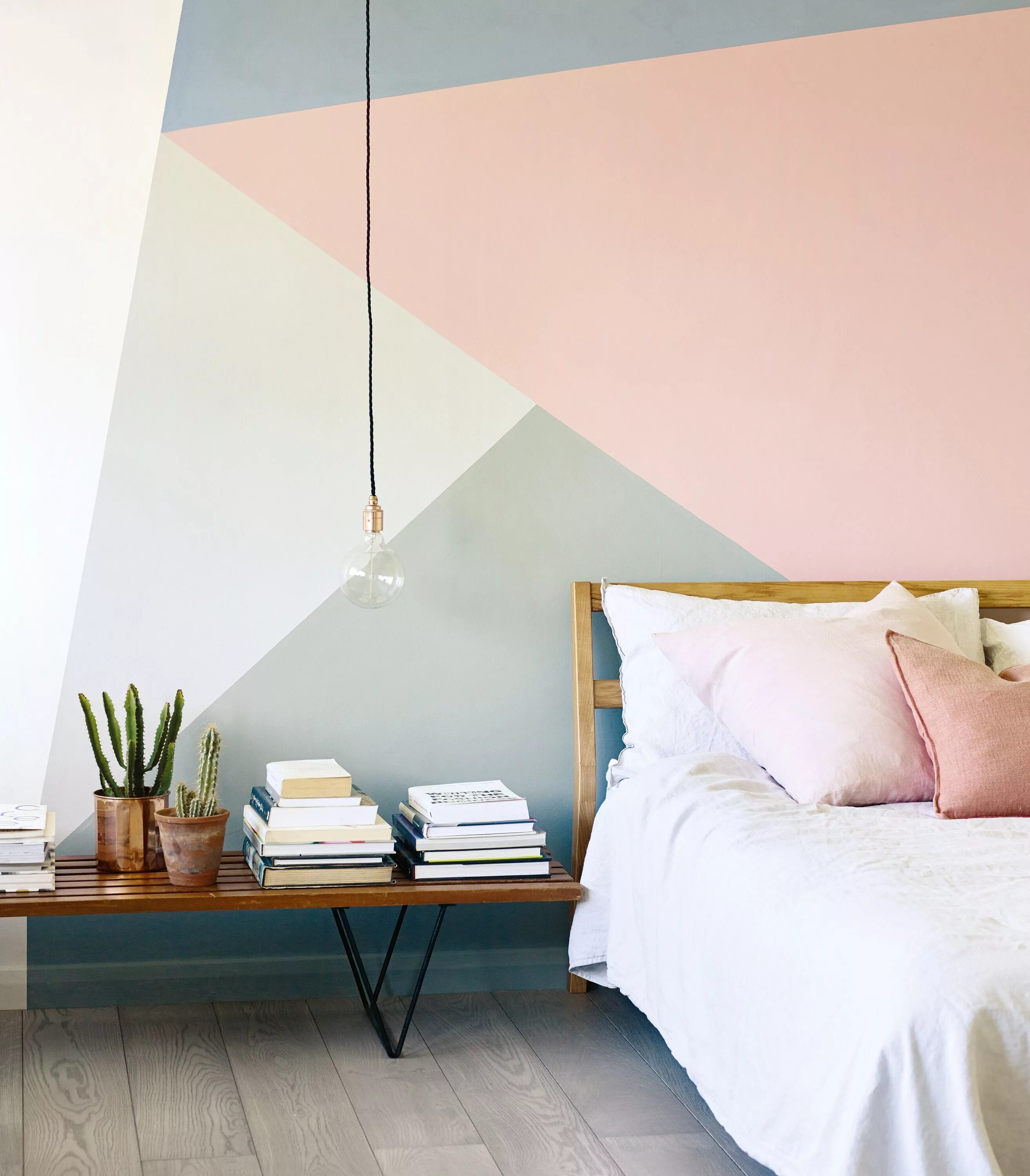 Покрасить комнату дизайн geometric wall pattern in pink, grey, blue and white by Fired Earth in a bedroom