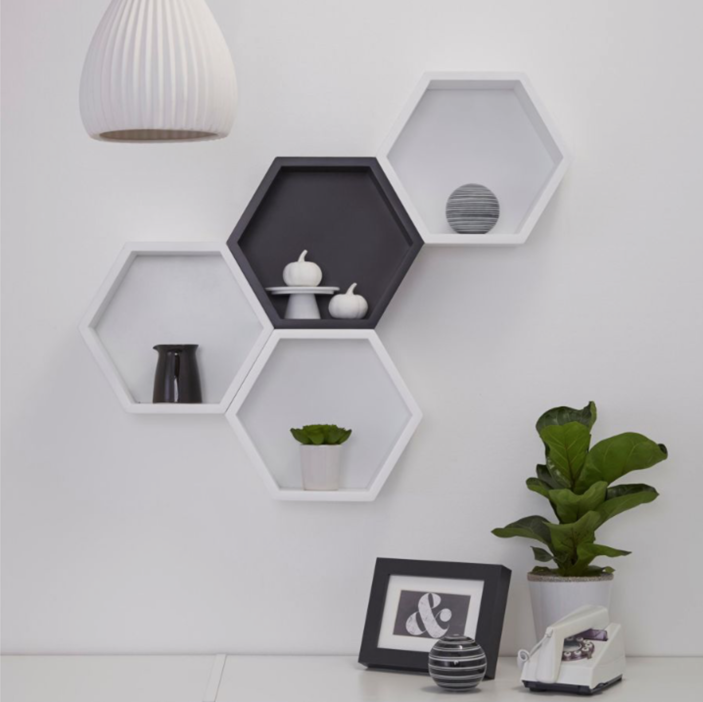 Полки соты на стену в интерьере Put up hexagons shelves for an interesting twist on the classic box shelf.