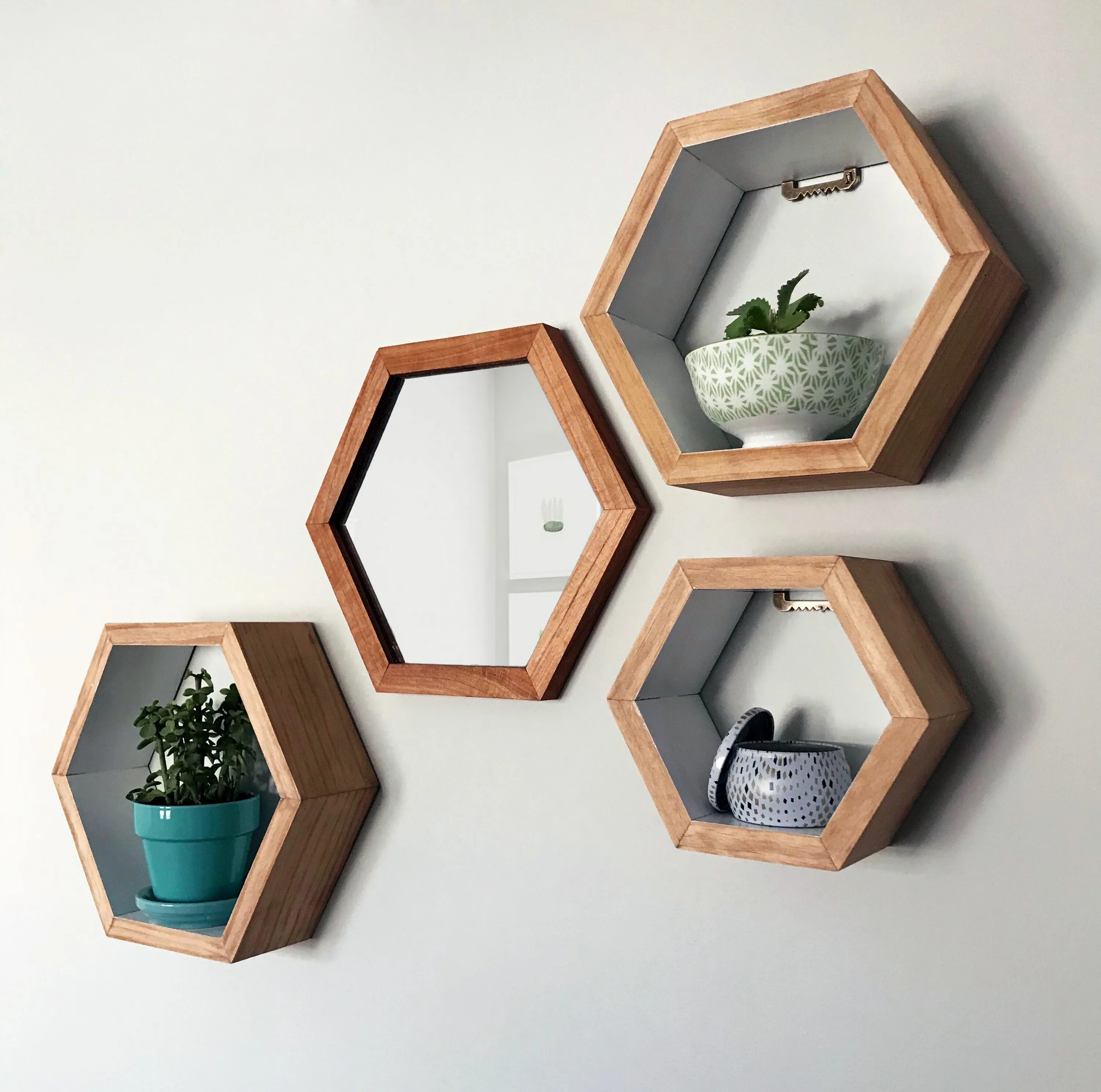 Полки соты в интерьере кухни фото Cherry wood hexagon mirror paired with hexagon shelves with a white interior. Av