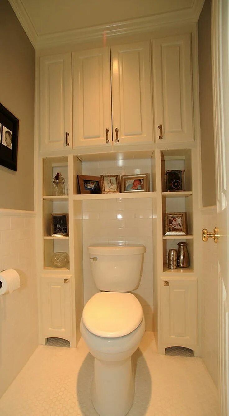 Полки в туалете за унитазом фото White cabinet with photos surrounding a white toilet Smart Over the Toilet Stora