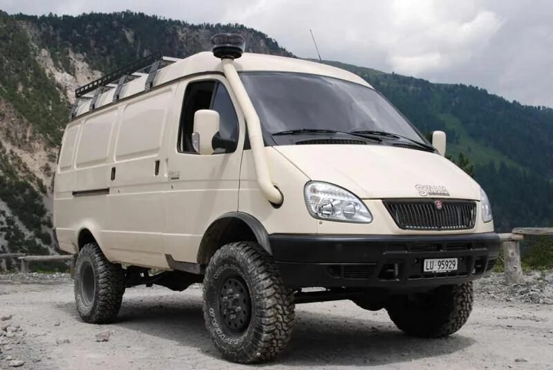 Полноприводная газель тюнинг White 4x4 Van Parked in Front of a Mountain