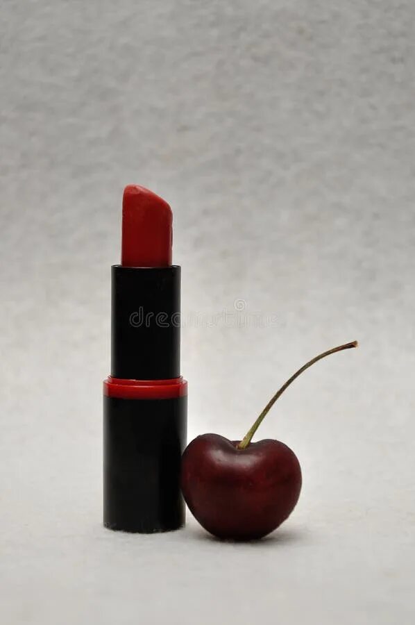 Помада вишня фото A Tube of Red Lipstick with a Cherry Stock Photo - Image of lipstick, color: 144