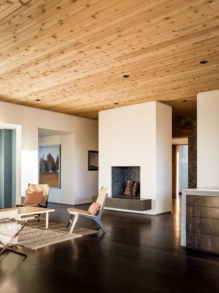 Потолок под дерево фото Spacious sitting features a central fireplace and a cedar ceiling in this home i