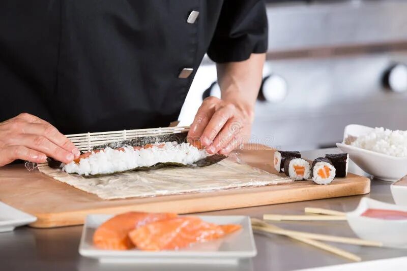 Повар суши фото Chef preparing sushi stock photo. Image of plate, background - 72851244