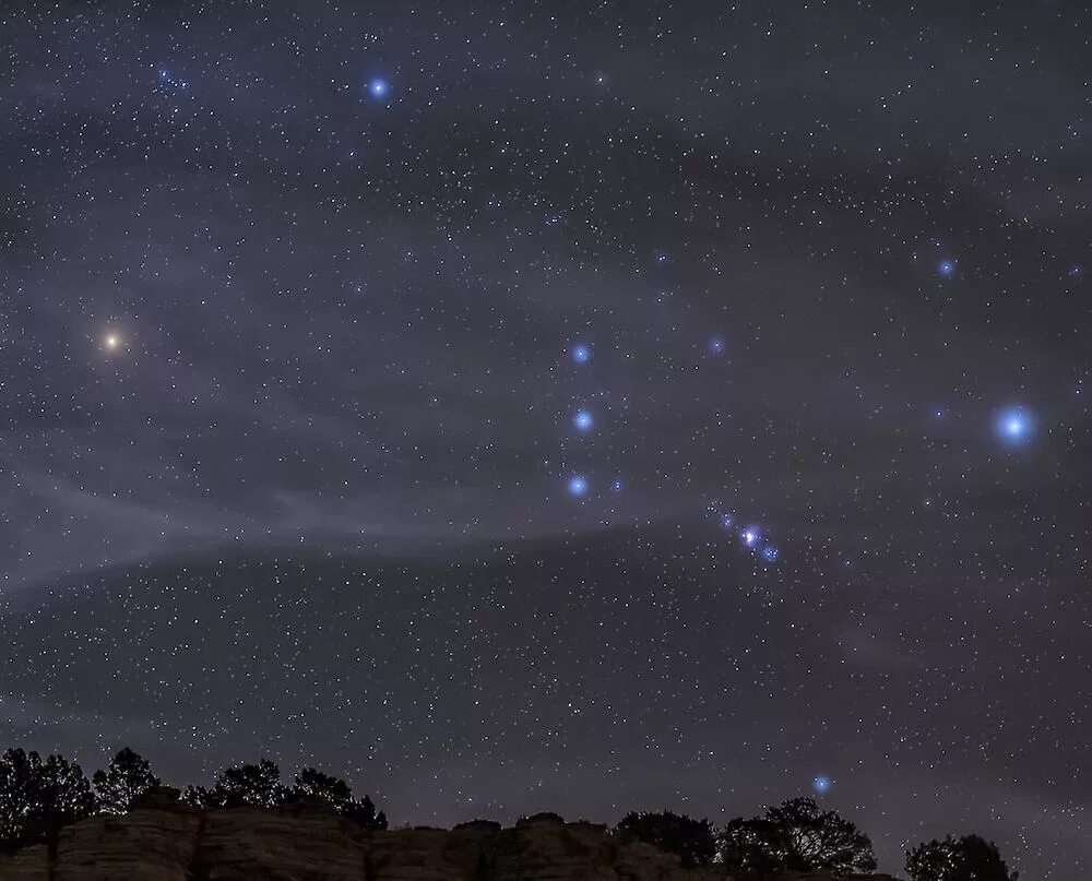 Пояс ориона на небе фото The Orion constellation rises over a hill through high thin clouds. Poster Fruug